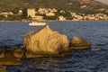 Large fragment of rock sticks out of the sea