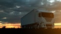 Large freight truck driving on a highway at sunset backlit by a bright orange sunburst under an ominous cloudy sky. 3d Rendering