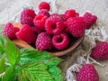 Large fresh red raspberry berries, poured into a wooden spoon Royalty Free Stock Photo