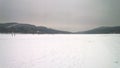 Large frozen lake covered in snow