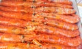 Large frozen langoustines in a package on the counter of a fish market, close-up Royalty Free Stock Photo