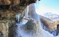 Large frozen waterfall in the mountains