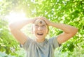 A large garden grape snail crawls over the girl`s face