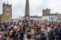 A large gathering of protesters kneel around the Obelisk at a Black Lives Matter protest in Richmond, North Yorkshire, with Royalty Free Stock Photo