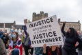 A large gathering of protesters kneel around the Obelisk at a Black Lives Matter protest in Richmond, North Yorkshire, with Royalty Free Stock Photo