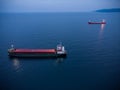 Large general cargo ship tanker bulk carrier, aerial view at night Royalty Free Stock Photo