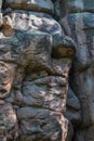 Large geometric stone rocks form of face profile in light of sun. Big cliff. Krasnoyarsk pillars, nature park in Siberia.