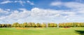 Large glade in the park in autumn day Royalty Free Stock Photo