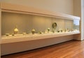 Large glass display with many clay and china items, Cleveland Art Museum,Ohio,2016