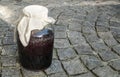 Large glass jar with sugar soaked sour cherries for alcohol fermentation Royalty Free Stock Photo