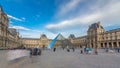 The large glass pyramid and the main courtyard of the Louvre Museum timelapse . Paris, France Royalty Free Stock Photo