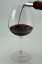 Large glass of wine being served with red wine Royalty Free Stock Photo