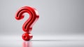 A large, glossy red question mark on a plain white background, highlighting its shape. Royalty Free Stock Photo