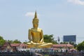 A large golden Buddha image sits along the Chao Phraya River at Wat Bang Chak in Nonthaburi
