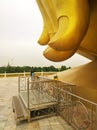 Large golden buddha statue with his big hand and fingers at WAT MUANG Muang Temple Ang Thong Province, THAILAND Royalty Free Stock Photo