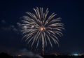 A large, golden firework explodes against Royalty Free Stock Photo