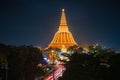 Large golden pagoda Located in the community at sunset , Phra Pathom Chedi , Nakhon Pathom province, Thailand. This is public