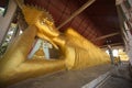 A large golden reclining Buddha image at Wat Somdet a historic site , A combination of Thai-Raman and Burmese art. Royalty Free Stock Photo