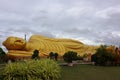 A large golden reclining Buddha in a temple in Songkhla, Thailand. Royalty Free Stock Photo