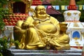 Large golden statue of seated laughing Buddha in Wat Koh Wanararm, Langkawi Island, Malaysia Royalty Free Stock Photo