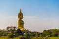 large golden yellow buddha At Wat Muang, which is an important religious tourist destination In Ang Thong Province in Thailand