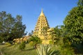 A large golden yellow pagoda at Wat Tha It In Ang Thong Province in Thailand