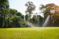 A large Golf course with a perfectly manicured lawn. The lawn needs watering. Lawn irrigation system on the Golf course Royalty Free Stock Photo