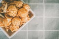 Large grain popcorn mixed with almonds, various nuts in a bowl, very appetizing. Placed on a striped veil, top view image