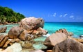 Large granite boulders in Anse Patates beach, La Digue Island, Indian ocean, Seychelles. Royalty Free Stock Photo
