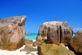 Large granite boulders in Anse Patates beach, La Digue Island, Indian ocean, Seychelles. Royalty Free Stock Photo