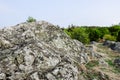 Large granite rocks covered with old moss are an inherent part of the harsh northern landscape of Sweden, Granna Royalty Free Stock Photo