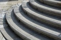Large granite staircase to a convex arch. the edges of the stairs are roughened by several notches in the stone. protection agains Royalty Free Stock Photo