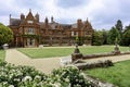 Grand Manor House with large gardens on a summer day. Royalty Free Stock Photo