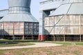 Large gray cooling towers for cooling water are in a row, energy, heat-exchange equipment at an oil refinery, petrochemical, chemi Royalty Free Stock Photo