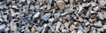 Large gray granite gravel background. Rubble as a background. Building stone