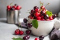 A large gray stick filled with sweet cherries and cherries of red and burgundy color. Royalty Free Stock Photo