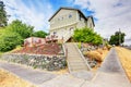 Large green craftsman classic American house exterior.