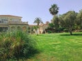 large green lawn in front of the house. Protaras. Ayia Napa. Cyprus. Royalty Free Stock Photo
