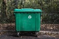 Large green recycle bin on the street of a park Royalty Free Stock Photo