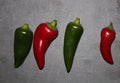 Large Green & Red Chili`s On A Slate Background Royalty Free Stock Photo