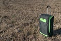 Large green suitcase on wheels Royalty Free Stock Photo