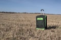 Large green suitcase on wheels Royalty Free Stock Photo