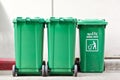 Large green trash cans