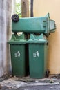 Large green wheelie bin not in use.