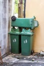 Large green wheelie bin not in use.