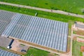 Large greenhouse agriculture for growing vegetable plants, aerial drone view