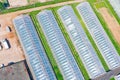 Large greenhouse agriculture for growing vegetable plants, aerial drone view