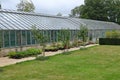 A large greenhouse in the kitchen garden of an English country houseA large greenhouse in the kitchen garden of an English country