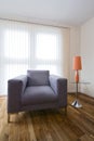 Large grey armchair with a coffee table