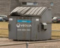 Large grey rubbish skip. locked by padlock, Cardboard recycling